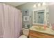 Cozy bathroom with a shower featuring a cute patterned curtain and neutral granite countertop at 2127 Yosemite Dr, Lebanon, IN 46052