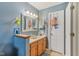 Well-lit bathroom featuring a vanity with wood cabinets and a large, framed mirror at 2127 Yosemite Dr, Lebanon, IN 46052