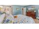 Charming bedroom featuring soft blue walls and a cozy, patterned quilt on the bed at 2127 Yosemite Dr, Lebanon, IN 46052