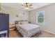 Inviting bedroom with a cozy bed, soft lighting, and a view of the outdoors through the window at 2127 Yosemite Dr, Lebanon, IN 46052