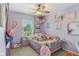 Charming bedroom adorned with playful decor, featuring a cozy bed and soft, inviting colors at 2127 Yosemite Dr, Lebanon, IN 46052