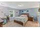 Cozy bedroom with a floral bedspread and natural light from the window at 2127 Yosemite Dr, Lebanon, IN 46052
