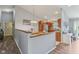 Open dining area next to the kitchen, featuring hardwood floors and a charming breakfast nook, perfect for casual meals at 2127 Yosemite Dr, Lebanon, IN 46052