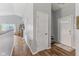 Hallway with hardwood floors, neutral paint, and lots of natural light at 2127 Yosemite Dr, Lebanon, IN 46052