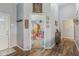 Hallway leading to a playroom with hardwood floors and neutral paint at 2127 Yosemite Dr, Lebanon, IN 46052