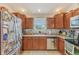 Well-lit kitchen with stainless steel appliances, plenty of counter space, and wooden cabinetry at 2127 Yosemite Dr, Lebanon, IN 46052