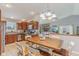 Open kitchen and dining area with stainless steel appliances and a view of the living room fireplace at 2127 Yosemite Dr, Lebanon, IN 46052