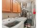 Functional laundry room with overhead cabinets, modern machines and well maintained systems at 2127 Yosemite Dr, Lebanon, IN 46052