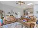 Open-concept living room featuring hardwood floors, a skylight, and comfortable seating, great for entertaining at 2127 Yosemite Dr, Lebanon, IN 46052