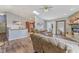 Spacious living room flowing into the kitchen, featuring hardwood floors, a skylight, and plenty of natural light at 2127 Yosemite Dr, Lebanon, IN 46052