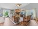 Cozy living room featuring a brick fireplace, hardwood floors, and sliding glass doors leading to the backyard at 2127 Yosemite Dr, Lebanon, IN 46052