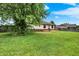 Spacious backyard featuring a deck, mature trees, and a well-maintained lawn, perfect for outdoor living and entertaining at 248 Eastview Dr, Bargersville, IN 46106