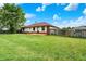 Green backyard featuring a new deck at 248 Eastview Dr, Bargersville, IN 46106