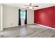 Large bedroom features wood-look flooring and a window with dark drapes at 248 Eastview Dr, Bargersville, IN 46106