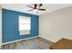 A bedroom with wood-look flooring and a modern ceiling fan at 248 Eastview Dr, Bargersville, IN 46106