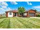 Single story home with brick and siding, and a lawn that is green and manicured at 248 Eastview Dr, Bargersville, IN 46106