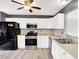 Modern kitchen features stainless steel appliances, white cabinets, and a spacious layout at 248 Eastview Dr, Bargersville, IN 46106