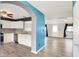 An open layout featuring new floors, white kitchen cabinetry, stainless steel appliances and an adjoining living room at 248 Eastview Dr, Bargersville, IN 46106