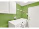 Bright laundry room has side-by-side washer and dryer at 248 Eastview Dr, Bargersville, IN 46106