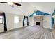 A living room featuring a brick fireplace, built in shelving, wood laminate flooring, ceiling fan, and white walls at 248 Eastview Dr, Bargersville, IN 46106