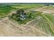 Picturesque aerial view of a property with multiple structures, surrounded by open fields at 26735 Six Points Rd, Sheridan, IN 46069