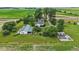 Lush aerial view of a home with green lawns and manicured landscaping at 26735 Six Points Rd, Sheridan, IN 46069