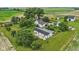 Scenic aerial view of a property with multiple buildings and a large, green yard at 26735 Six Points Rd, Sheridan, IN 46069