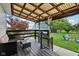 Cozy covered porch with outdoor seating, ideal for relaxing and enjoying the backyard view at 26735 Six Points Rd, Sheridan, IN 46069