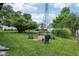 Lush backyard with a fire pit surrounded by comfortable seating, perfect for outdoor gatherings and relaxation at 26735 Six Points Rd, Sheridan, IN 46069