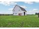 Well-maintained white barn with ample space and rustic charm, perfect for agricultural use or storage at 26735 Six Points Rd, Sheridan, IN 46069