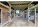Inside a wooden barn, with a view of a fenced pasture at 26735 Six Points Rd, Sheridan, IN 46069