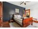 Cozy bedroom with hardwood floors, area rug, wood trim and unique wall color at 26735 Six Points Rd, Sheridan, IN 46069