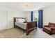 Bedroom features carpeted floors, natural light, and dark wood trim at 26735 Six Points Rd, Sheridan, IN 46069