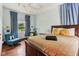 Bright bedroom boasts hardwood floors, bed with decorative pillows, and window with natural light at 26735 Six Points Rd, Sheridan, IN 46069