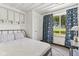 Inviting bedroom featuring a comfortable bed and scenic window views at 26735 Six Points Rd, Sheridan, IN 46069