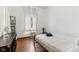 Cozy bedroom features a bright window, vintage decor, and a comfortable bed at 26735 Six Points Rd, Sheridan, IN 46069