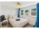 Bright bedroom with natural light, colorful accents, and neutral walls at 26735 Six Points Rd, Sheridan, IN 46069