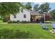 Well-maintained home with a lush front yard and a quaint porch, perfect for relaxing at 26735 Six Points Rd, Sheridan, IN 46069