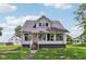Charming two-story home featuring a red front door and large windows, perfect for natural light at 26735 Six Points Rd, Sheridan, IN 46069