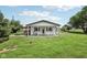 Charming home featuring a covered porch, white siding, and a well-maintained lawn in a rural setting at 26735 Six Points Rd, Sheridan, IN 46069
