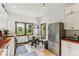 Bright eat-in kitchen with stainless steel refrigerator, white cabinets, and views of outside at 26735 Six Points Rd, Sheridan, IN 46069