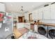 Charming kitchen features white cabinets, butcher block counters, and stainless steel appliances at 26735 Six Points Rd, Sheridan, IN 46069