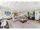 Expansive living room with open floor plan, large sectional, and lots of light at 26735 Six Points Rd, Sheridan, IN 46069