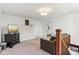 Comfortable upstairs living room with carpeting, tv, and seating at 26735 Six Points Rd, Sheridan, IN 46069
