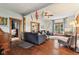 Spacious living room features hardwood floors, neutral paint, and ample seating for Gathering and guests at 26735 Six Points Rd, Sheridan, IN 46069