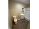 Bathroom featuring a toilet, vanity, and shower/tub combo at 3059 5Th E Ave, Indianapolis, IN 46221
