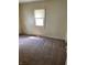 Neutral bedroom with neutral carpet, natural light, and classic trim at 3059 5Th E Ave, Indianapolis, IN 46221