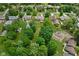 A high altitude aerial view shows the lush backyard and the surrounding community at 3818 S Creekside Dr, New Palestine, IN 46163