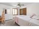 Bedroom with a bed, dresser, closet, and window with blinds at 3818 S Creekside Dr, New Palestine, IN 46163