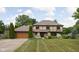 Charming two-story home featuring a well-manicured lawn, stone accents, and a two-car garage at 3818 S Creekside Dr, New Palestine, IN 46163